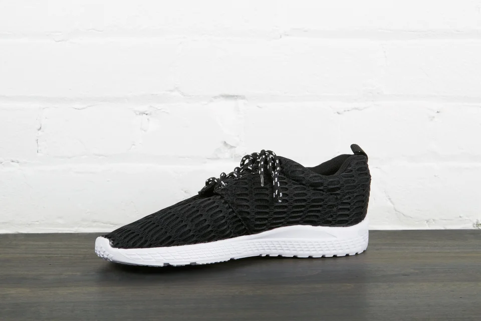Black sneakers with white sole